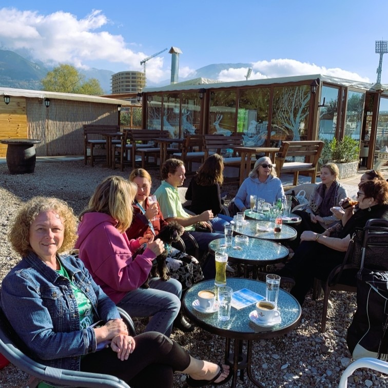 people visiting around tables