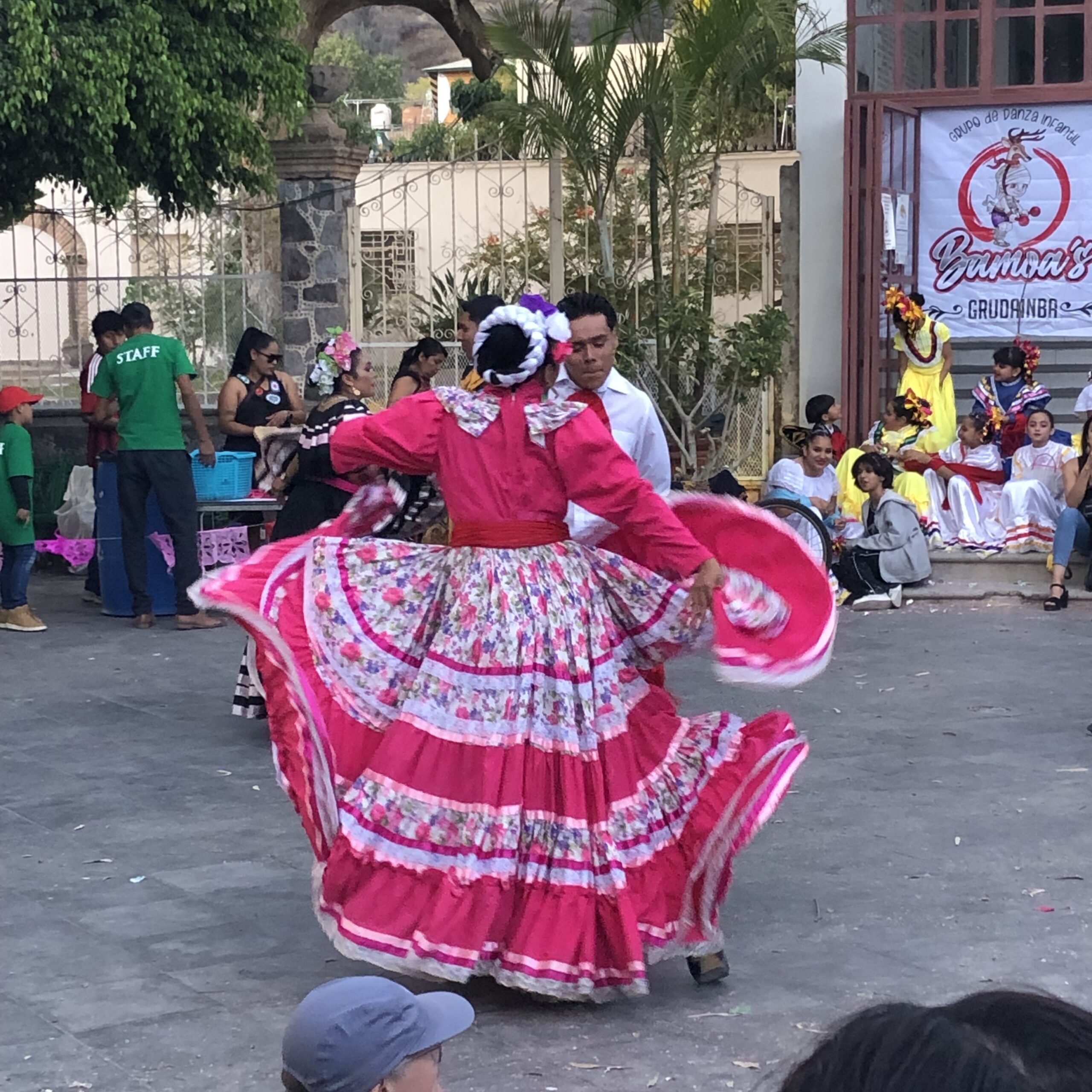 Woman dancing in Mexico with pink dress