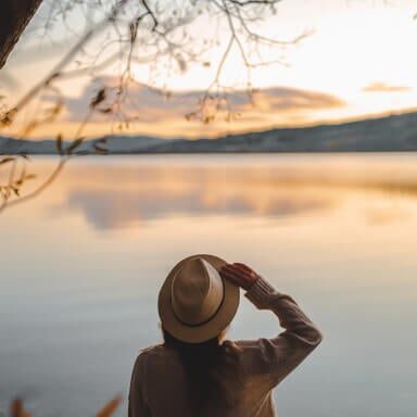 Lady looking over a lake
