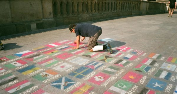 man drawing on floor