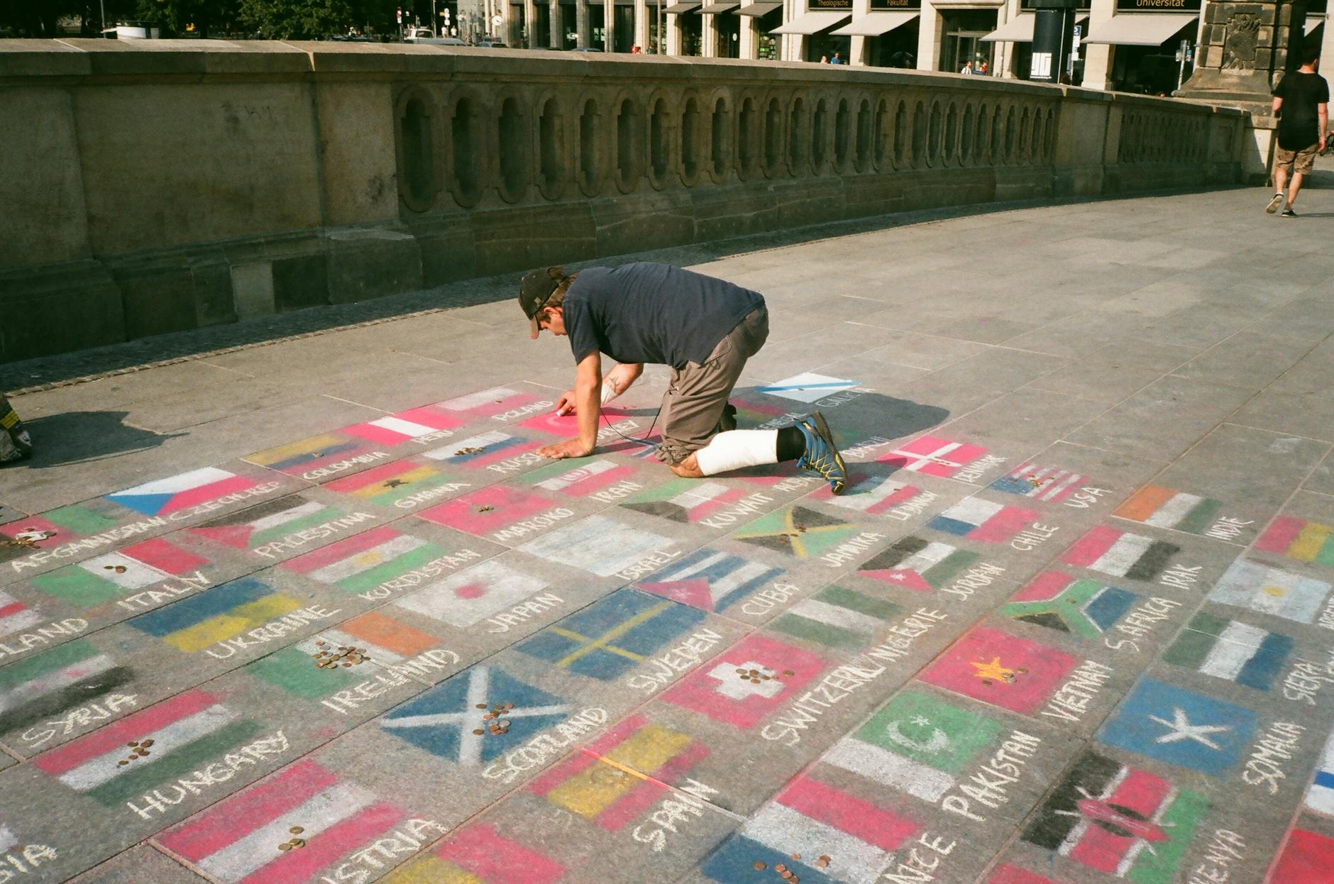 man drawing on floor