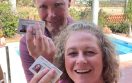 Permanent residency in Mexico. Two people holding their residency cards.